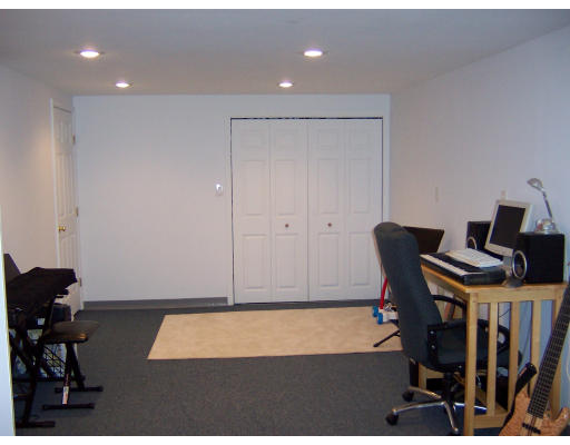 21 5th Avenue, Unit 21 Watertown, MA 02472 - Photo 12 of 15 a workspace with furniture and wooden floor
