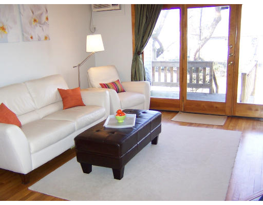 21 5th Avenue, Unit 21 Watertown, MA 02472 - Photo 2 of 15 a living room with furniture and a large window