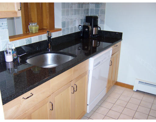 21 5th Avenue, Unit 21 Watertown, MA 02472 - Photo 7 of 15 a kitchen with a sink and a cabinets