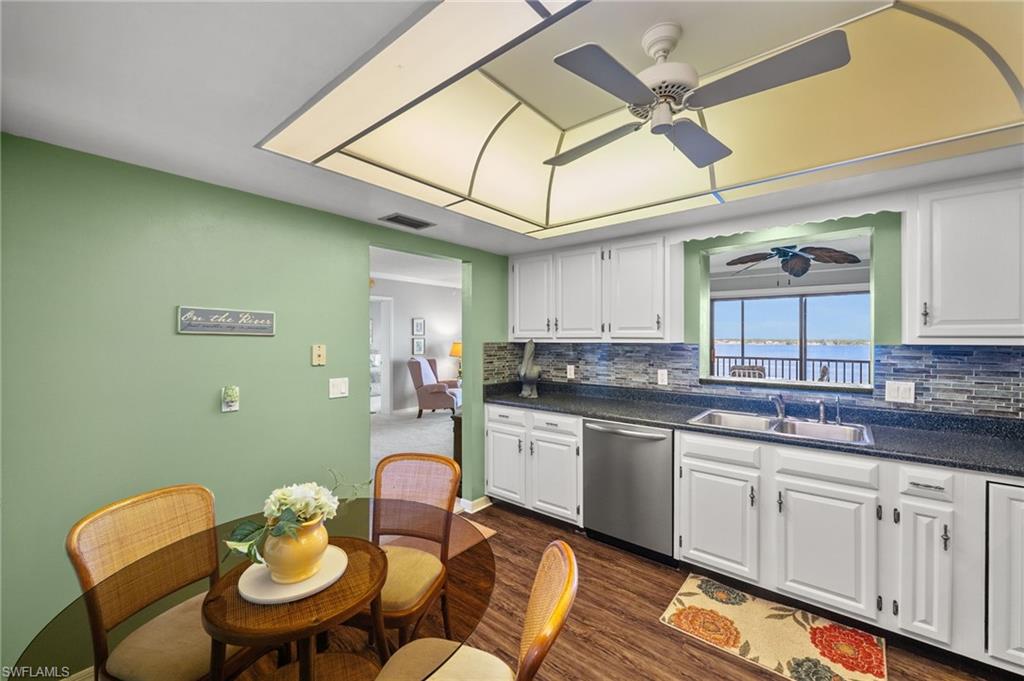 1900 Virginia Avenue, Unit 902 Fort Myers, FL 33901 - Photo 15 of 41 a kitchen with a sink cabinets and appliances
