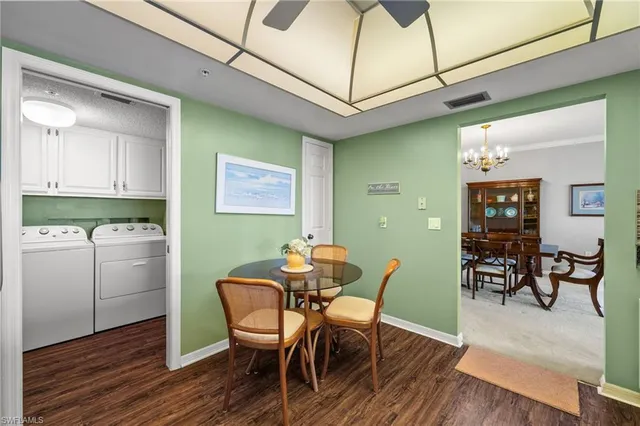 a dining room with furniture and wooden floor