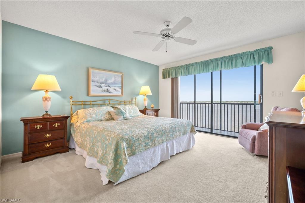 1900 Virginia Avenue, Unit 902 Fort Myers, FL 33901 - Photo 17 of 41 a bedroom with a bed and a dresser next to a window