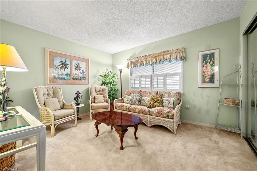 1900 Virginia Avenue, Unit 902 Fort Myers, FL 33901 - Photo 26 of 41 a living room with furniture and a large window