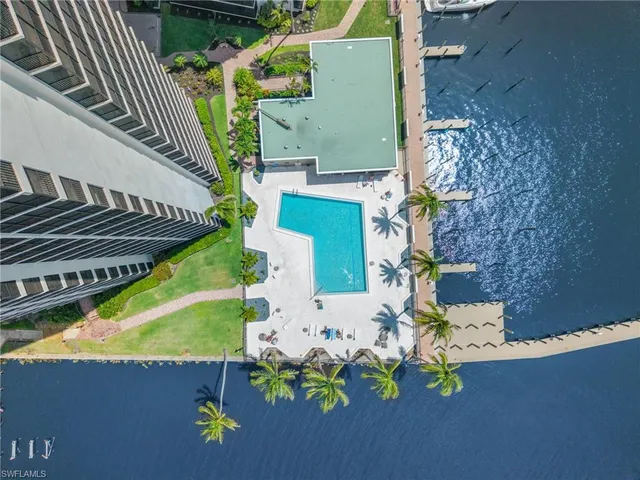 an aerial view of a house with a swimming pool