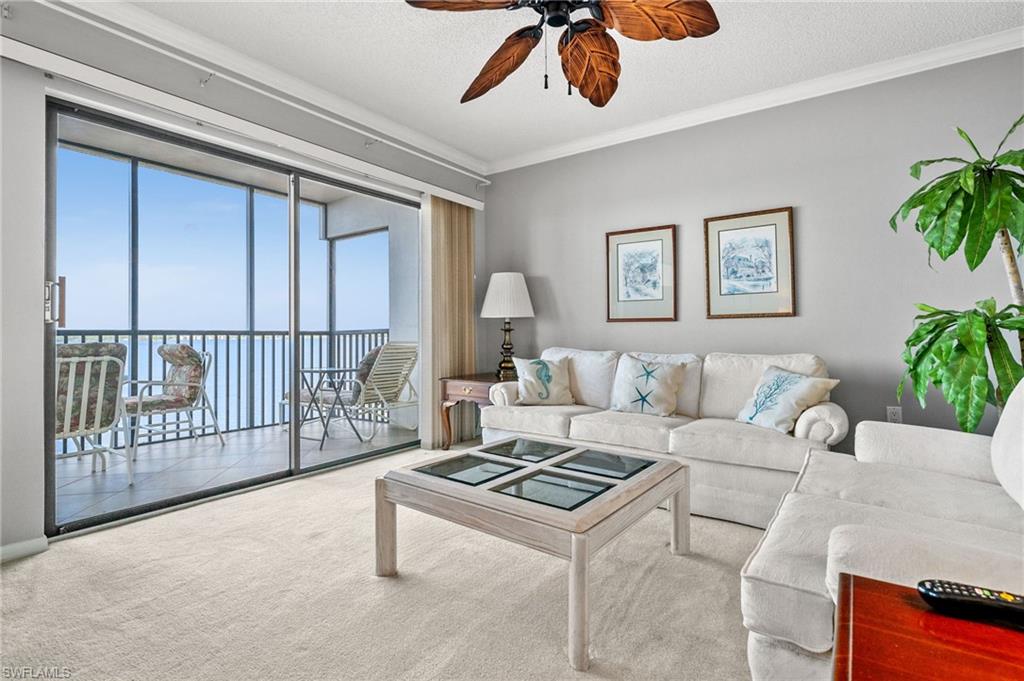 1900 Virginia Avenue, Unit 902 Fort Myers, FL 33901 - Photo 7 of 41 a living room with furniture and a potted plant