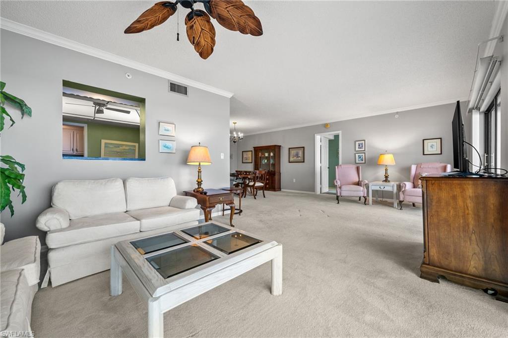 1900 Virginia Avenue, Unit 902 Fort Myers, FL 33901 - Photo 9 of 41 a living room with furniture and a table