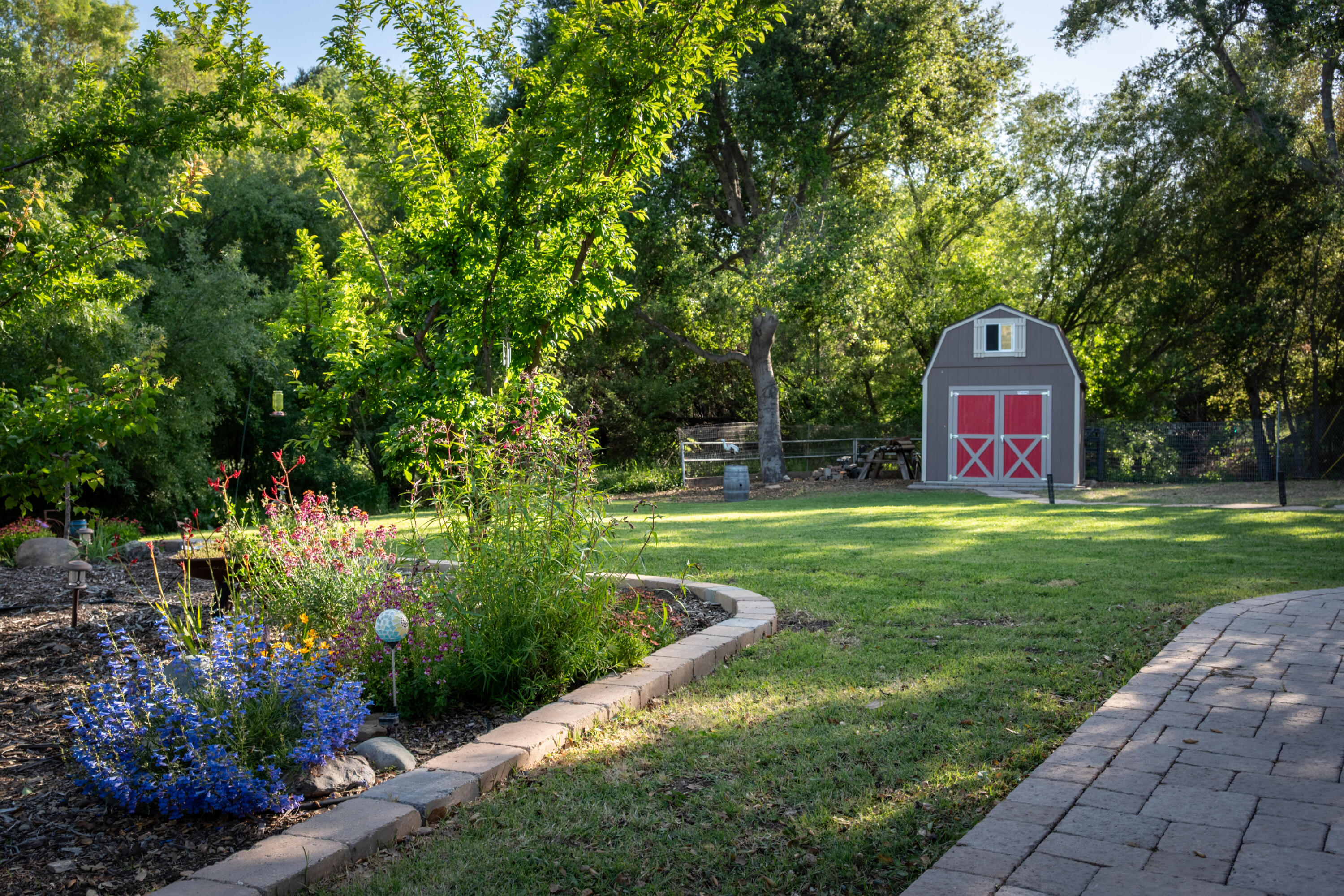 710 Ballard Canyon Road Solvang, CA 93463 - Photo 19 of 23 a front view of a house with a yard and a garden
