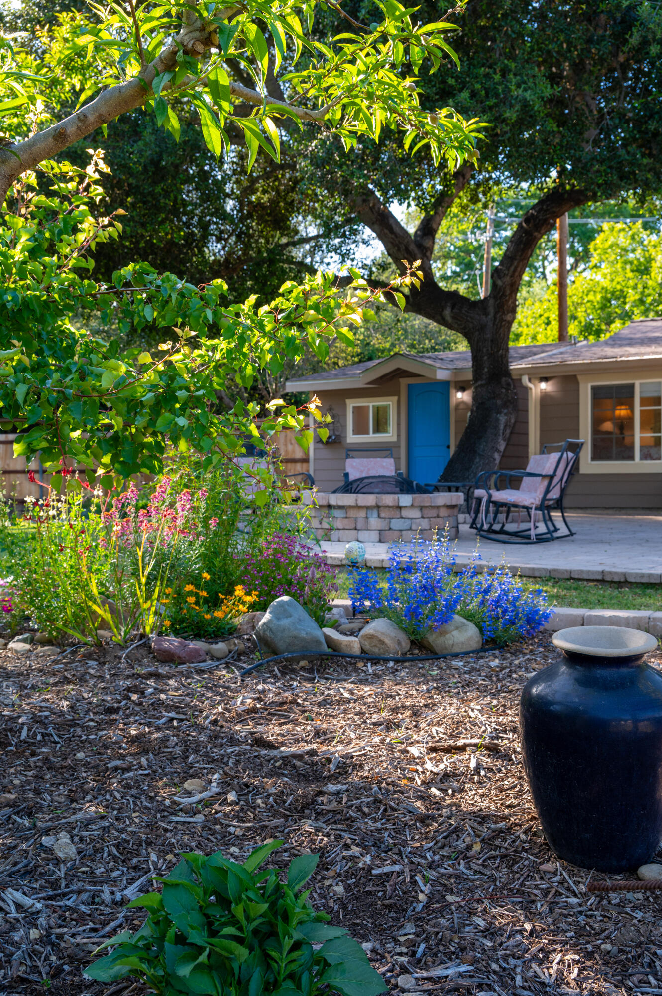 710 Ballard Canyon Road Solvang, CA 93463 - Photo 20 of 23 a view of a house with backyard sitting area and garden