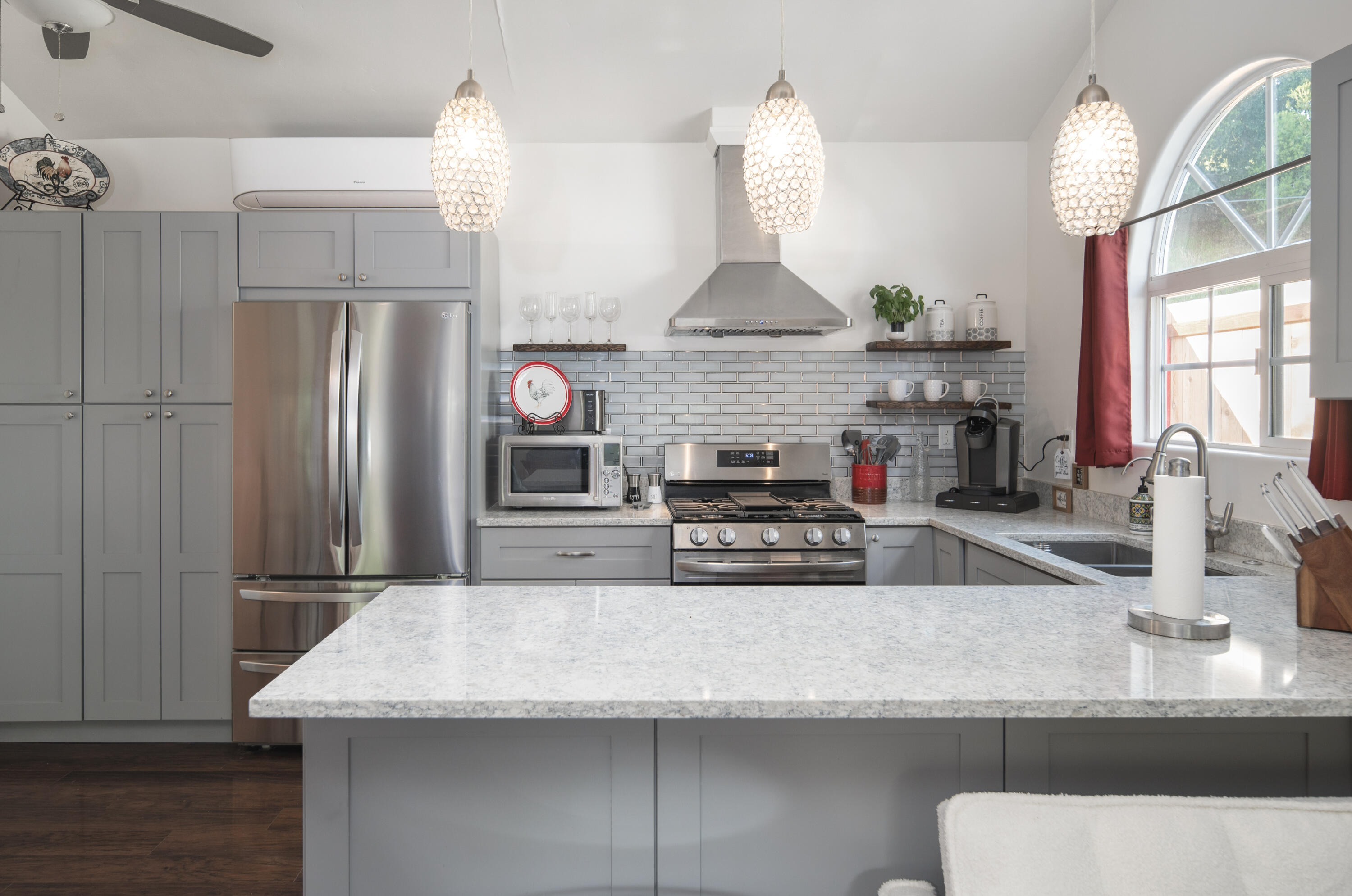 710 Ballard Canyon Road Solvang, CA 93463 - Photo 6 of 23 a kitchen with kitchen island granite countertop a sink and a refrigerator