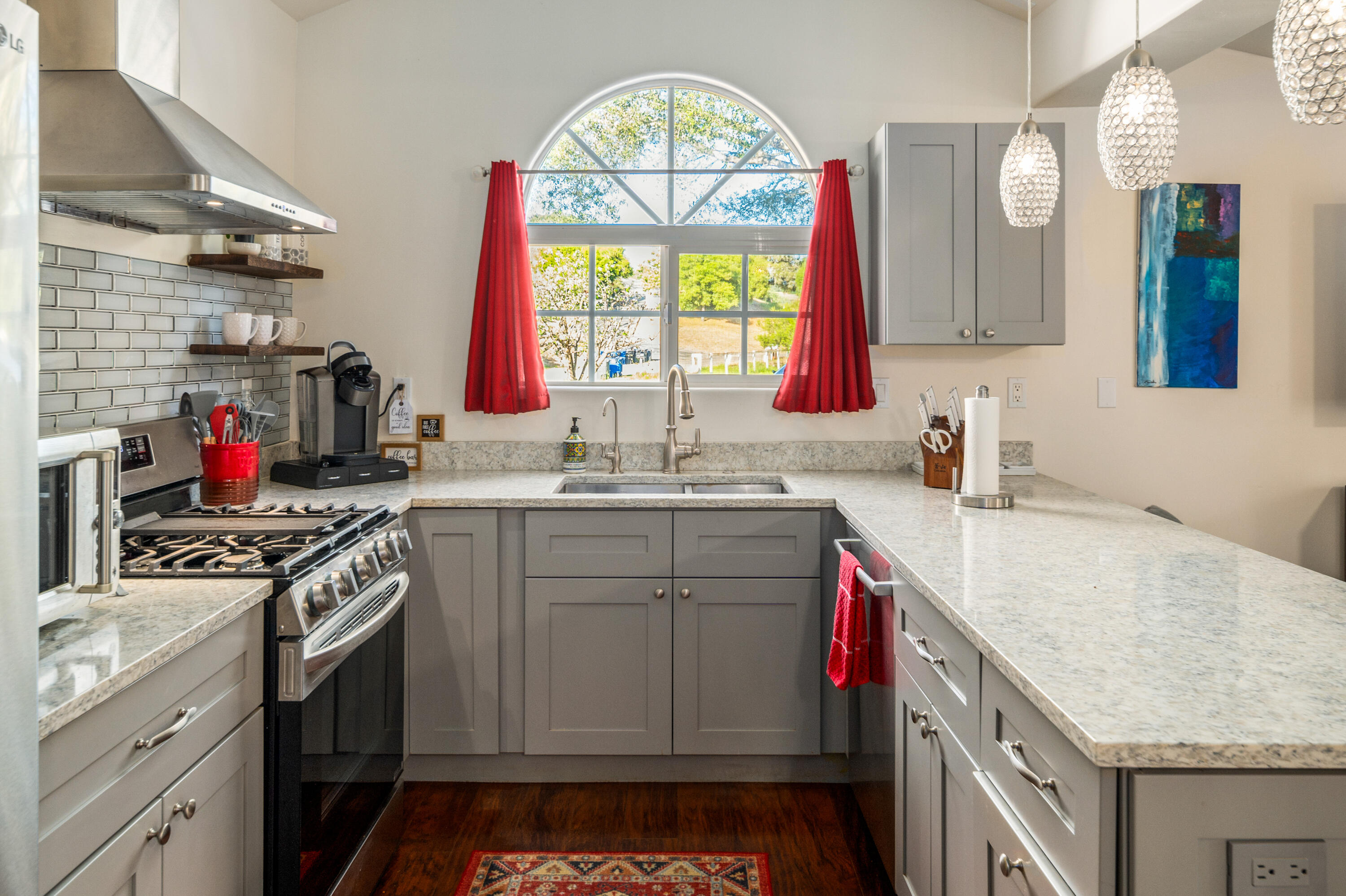 710 Ballard Canyon Road Solvang, CA 93463 - Photo 7 of 23 a kitchen with a sink stove top oven and cabinets