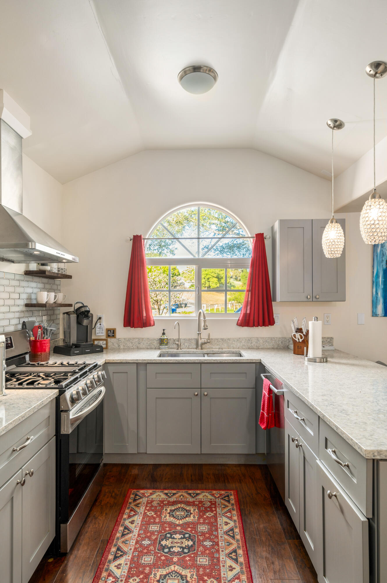 710 Ballard Canyon Road Solvang, CA 93463 - Photo 8 of 23 a kitchen with a sink stove and cabinets