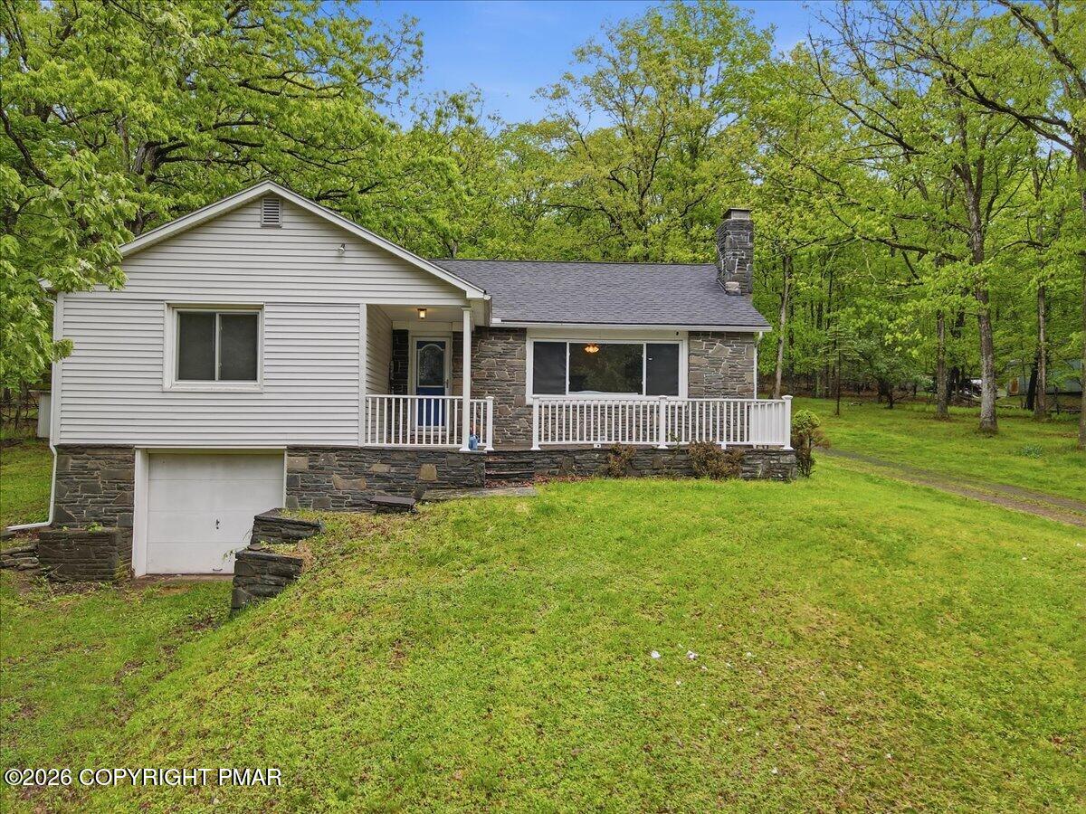 232 Garrity Road Hawley, PA 18428 - Photo 2 of 57 a front view of house with yard and green space