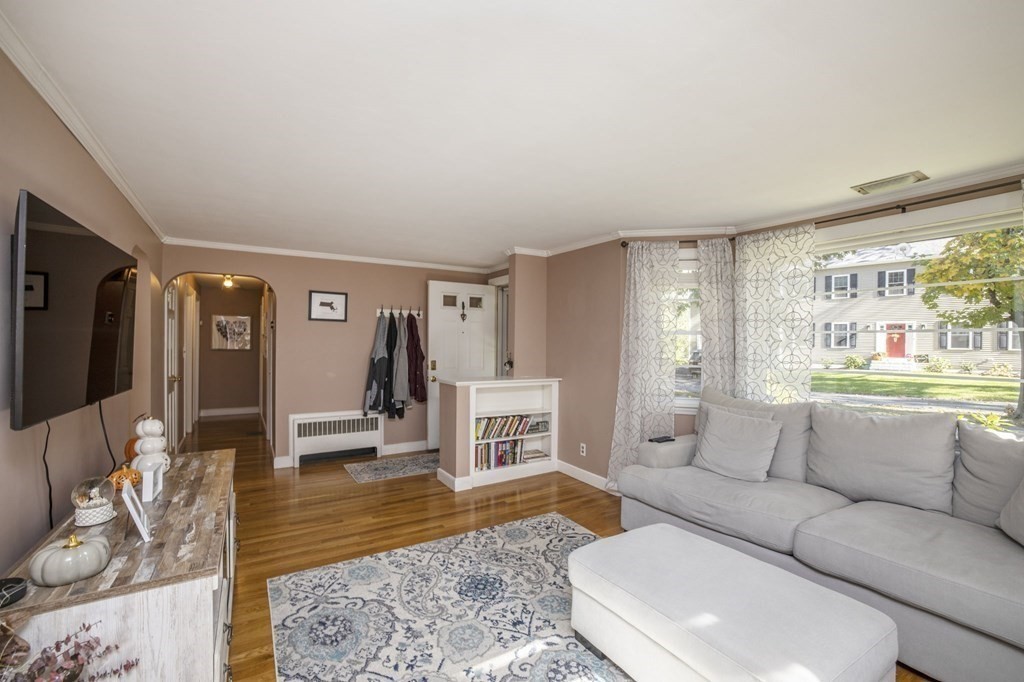 14 Old Randolph Street Canton, MA 02021 - Photo 7 of 32 a living room with furniture and a flat screen tv