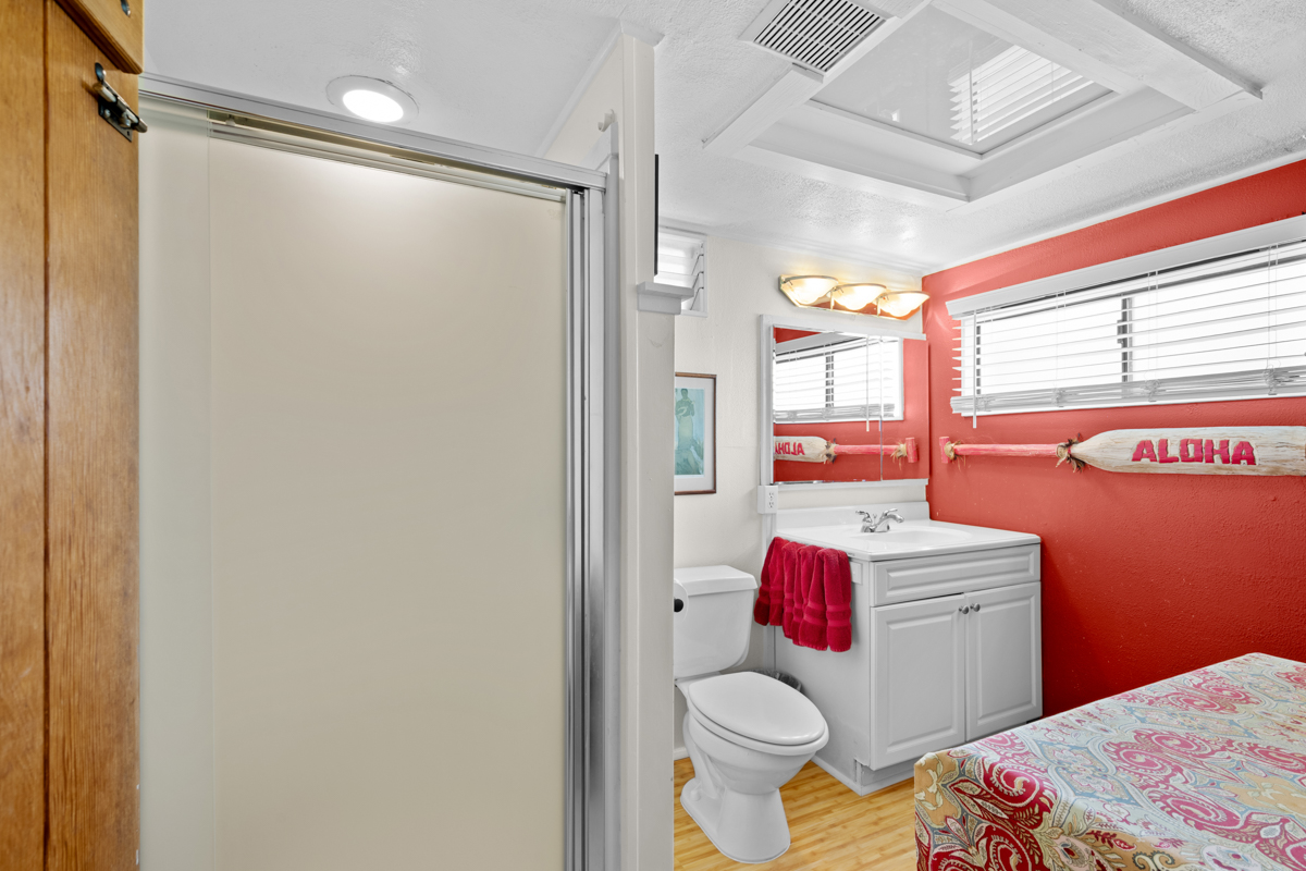 66-1685 Kohala Mountain Road Kamuela, HI 96743 - Photo 20 of 26 a bathroom with a sink toilet vanity and shower