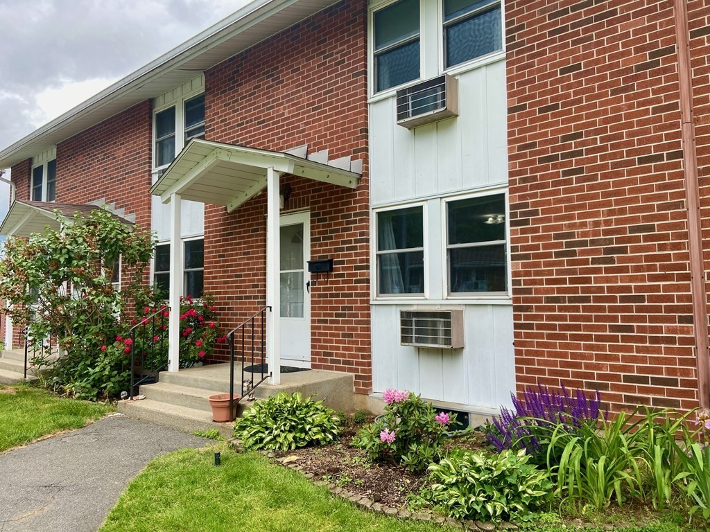 113 Manor Court, Unit 113 Springfield, MA 01118 - Photo 1 of 19 a view of a house with potted plants