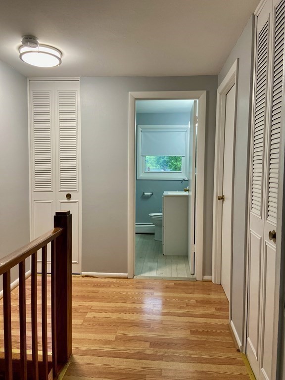 113 Manor Court, Unit 113 Springfield, MA 01118 - Photo 11 of 19 a view of a room with wooden floor cabinet and a bathroom