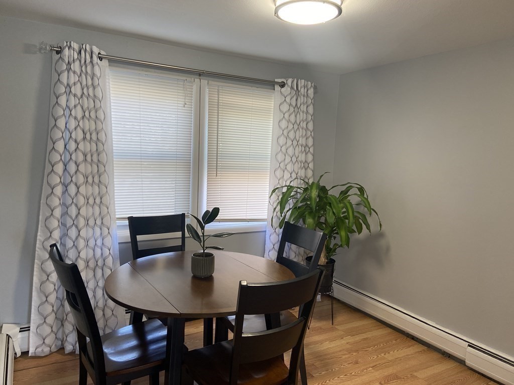 113 Manor Court, Unit 113 Springfield, MA 01118 - Photo 5 of 19 a view of a dining room with furniture and window