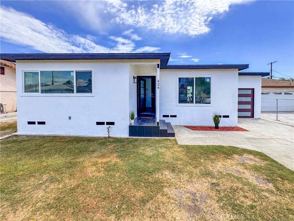 434 West Poplar Street Compton, CA 90220 - Photo 3 of 18 a view of a house with swimming pool in front of it