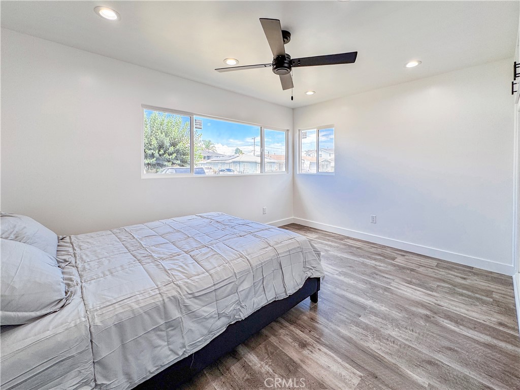 434 West Poplar Street Compton, CA 90220 - Photo 7 of 18 a bedroom with a bed and a window
