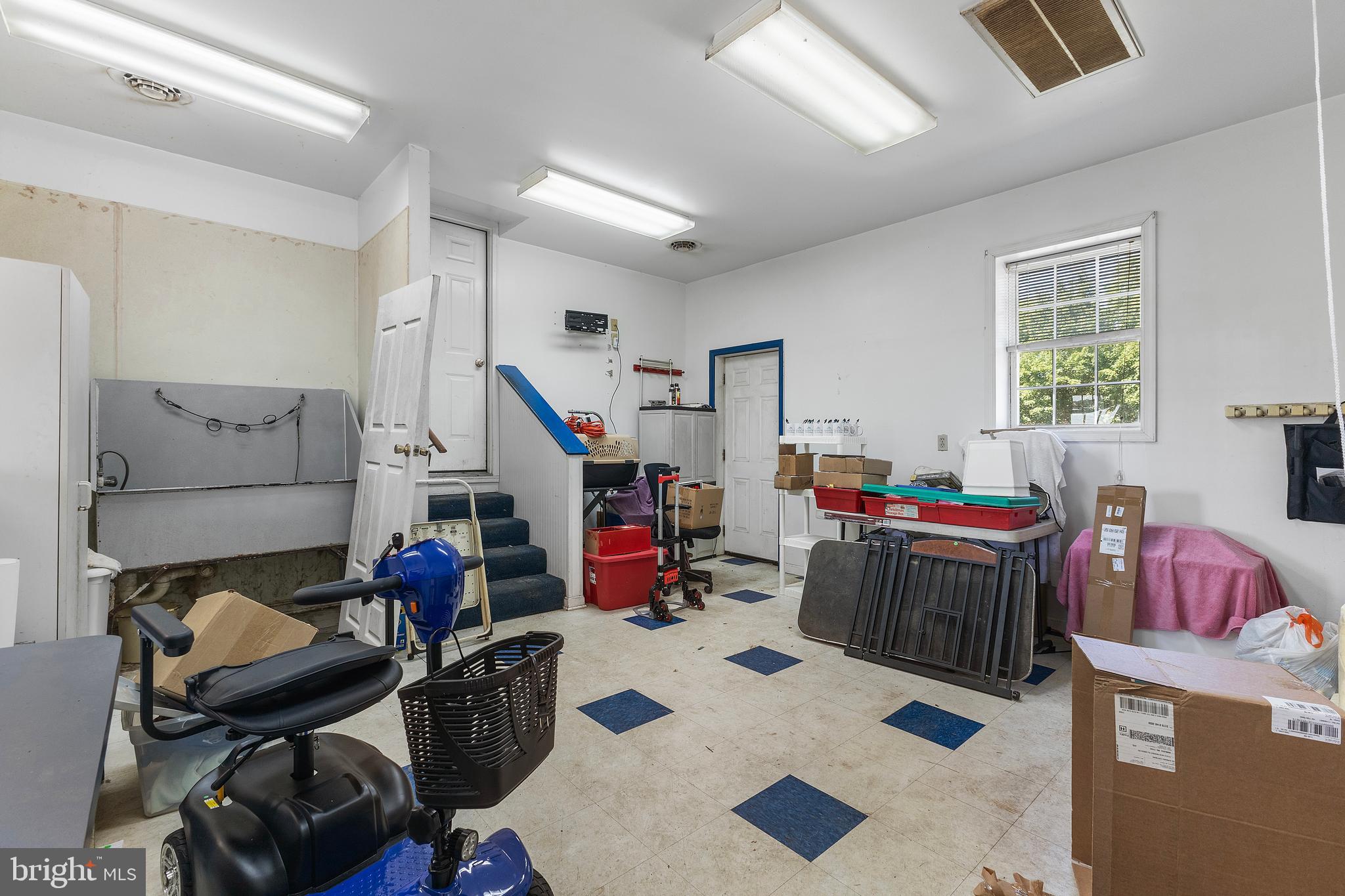 7112 East New Market Ellwood Road Hurlock, MD 21643 - Photo 35 of 41 a view of a workspace with furniture and a couch