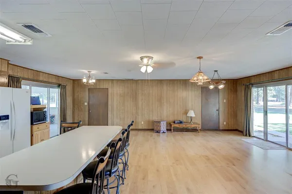 a view of a room with furniture and window