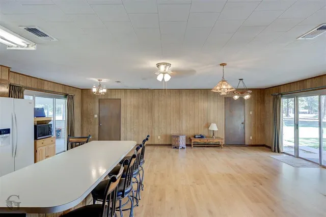 a view of a room with furniture and window