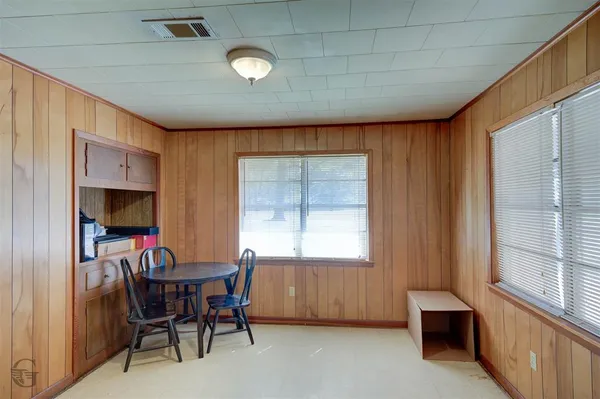 a view of a livingroom with furniture and a window
