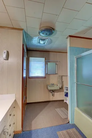 a kitchen with stainless steel appliances granite countertop a sink and cabinets