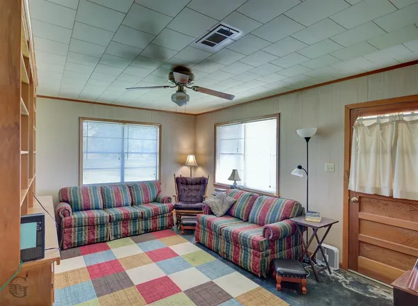 a living room with furniture and a rug