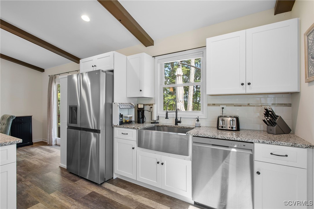 321 Johnson Mill Road Bumpass, VA 23024 - Photo 13 of 33 a kitchen with a refrigerator a sink and cabinets