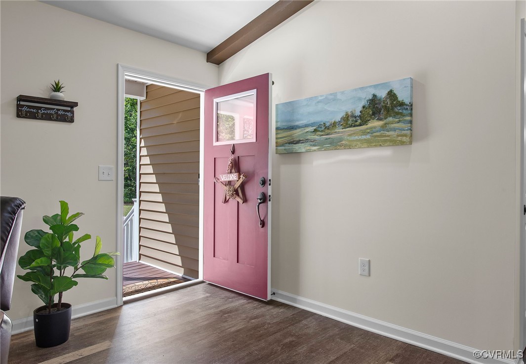 321 Johnson Mill Road Bumpass, VA 23024 - Photo 16 of 33 a view of a hallway with wooden floor and a potted plant