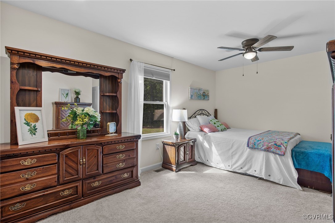 321 Johnson Mill Road Bumpass, VA 23024 - Photo 20 of 33 a bedroom with a bed dresser and a window