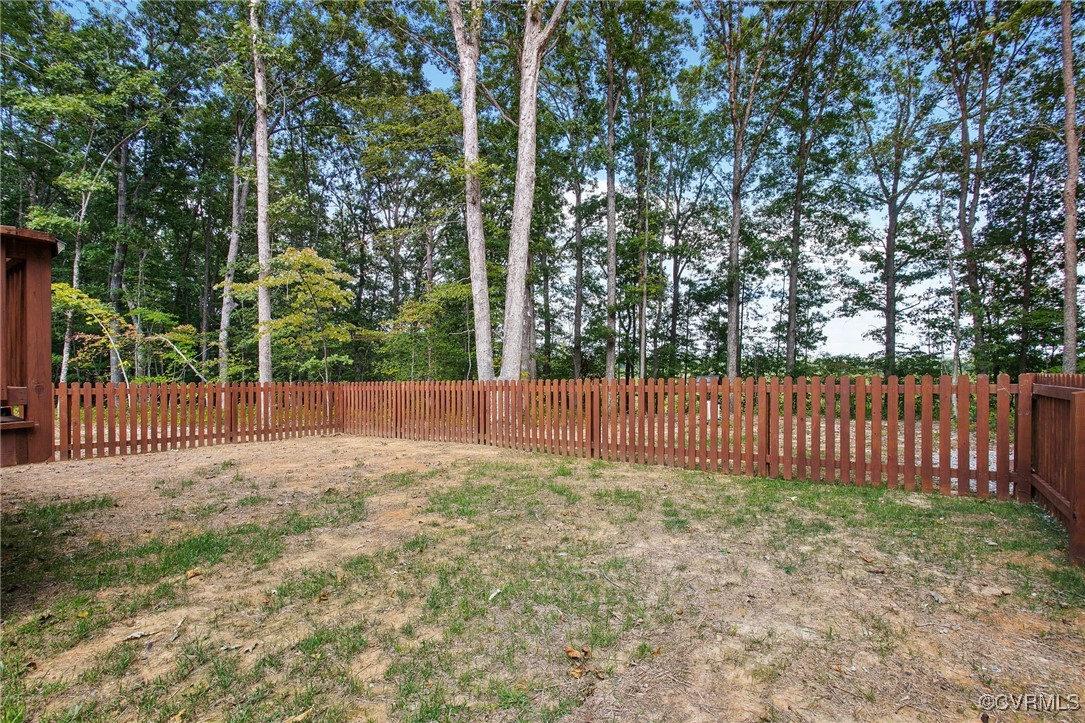 321 Johnson Mill Road Bumpass, VA 23024 - Photo 26 of 33 a view of a yard with wooden fence