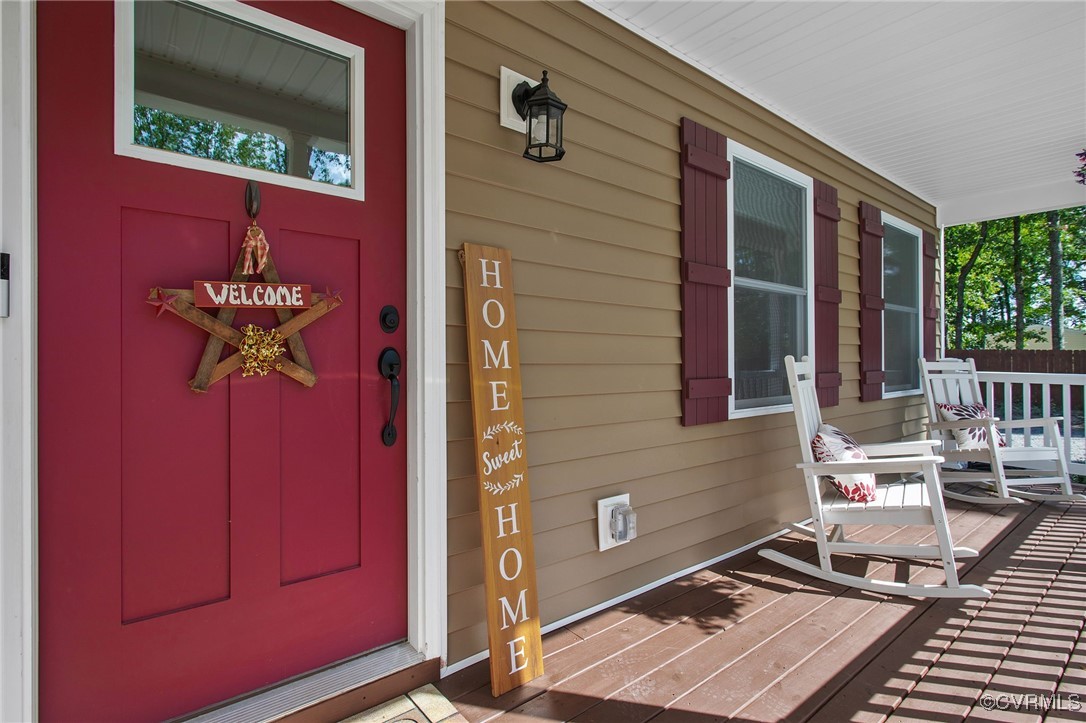 321 Johnson Mill Road Bumpass, VA 23024 - Photo 4 of 33 a front view of a house with a lounge chair