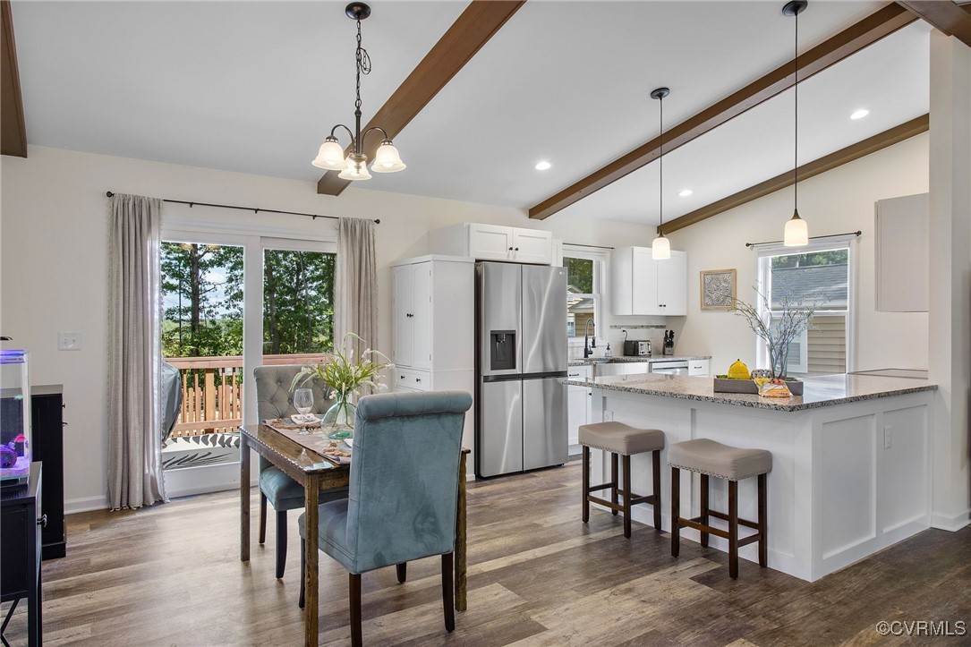 321 Johnson Mill Road Bumpass, VA 23024 - Photo 7 of 33 a view of a dining room with furniture window and wooden floor