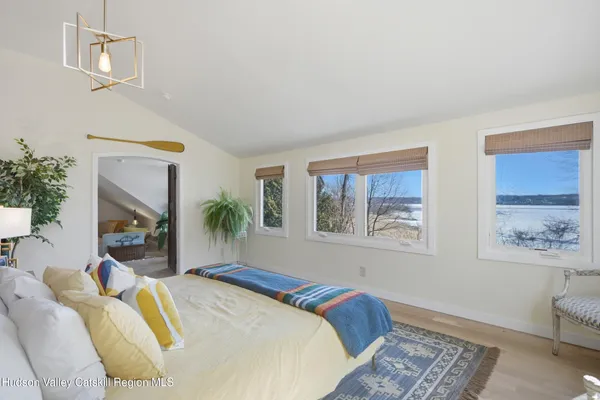 a room with lots of furniture and wooden floor