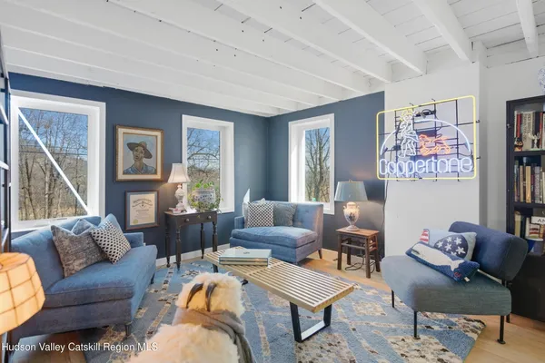 a dining room with furniture and window
