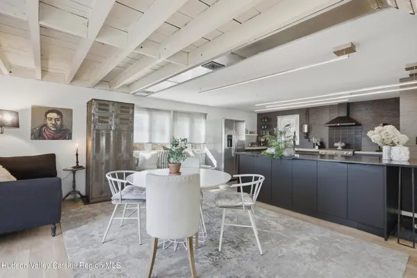 a kitchen with kitchen island granite countertop a sink and cabinets