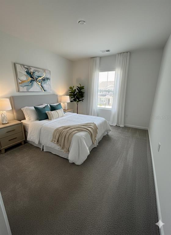 2626 Skyline Loop Kissimmee, FL 34758 - Photo 6 of 13 a bedroom with bed and window