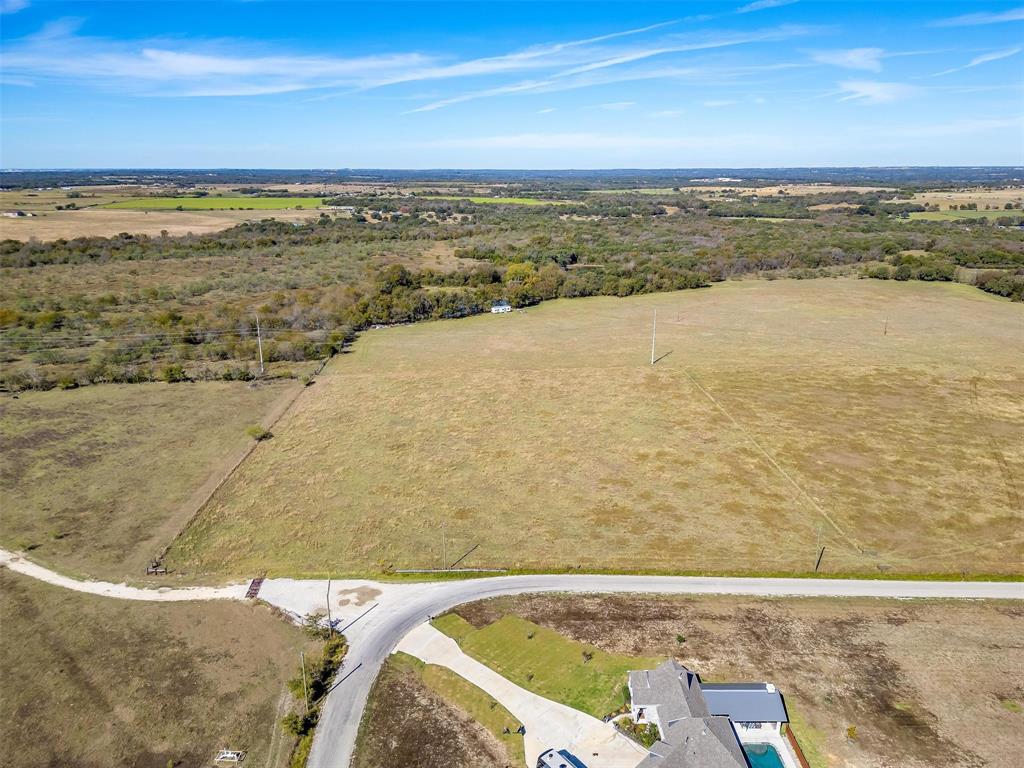 0 County Road 410 Road Alvarado, TX 76009 - Photo 2 of 12 Expansive rural landscape featuring a mix of open fields and natural tree lines