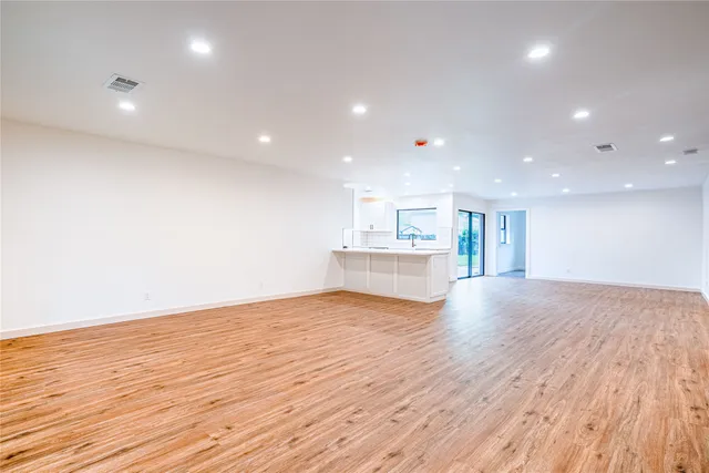 a view of kitchen and wooden floor