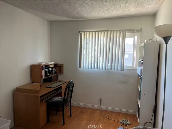 a room with cabinets and wooden floor