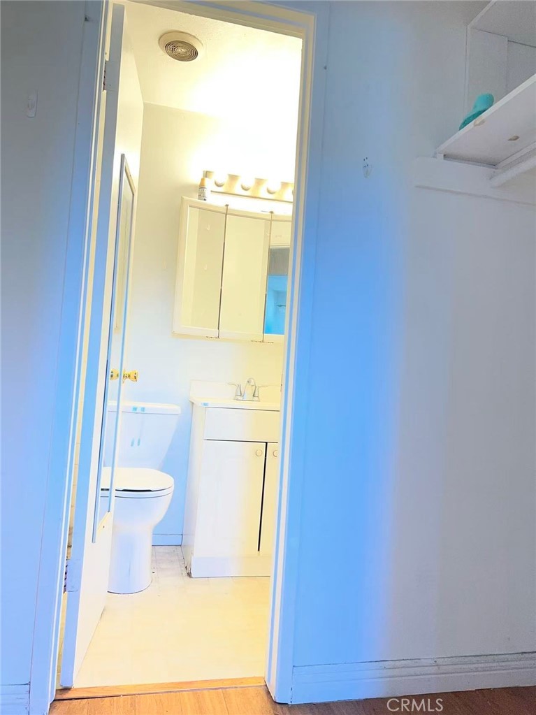 1777 Mitchell Avenue, Unit 92 Tustin, CA 92780 - Photo 10 of 13 a bathroom with a toilet and a sink