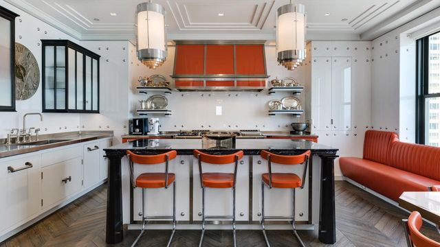 a kitchen with stainless steel appliances granite countertop a sink and a refrigerator