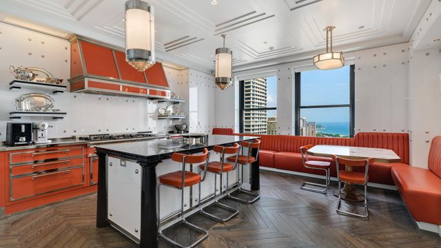 a kitchen with stainless steel appliances granite countertop a stove and a wooden cabinets