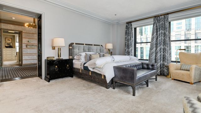 a bedroom with a bed and a couch