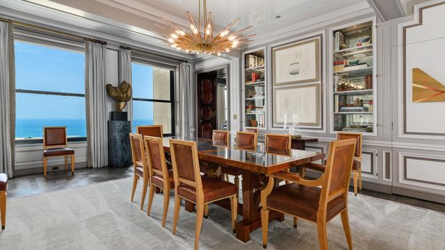 a dining room with furniture and window