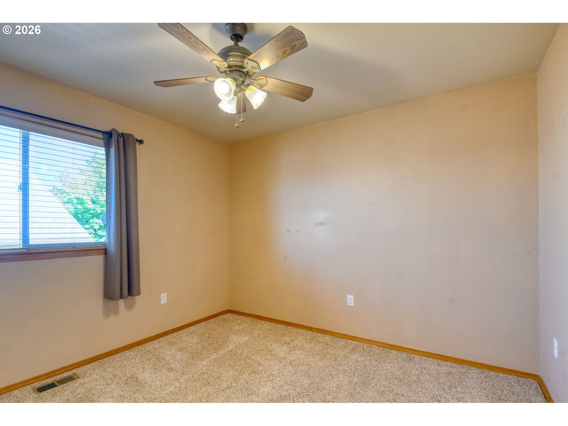 1614 Southwest 3rd Street Pendleton, OR 97801 - Photo 22 of 40 an empty room with windows and chandelier fan