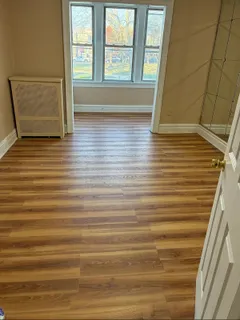 a view of front door and wooden floor
