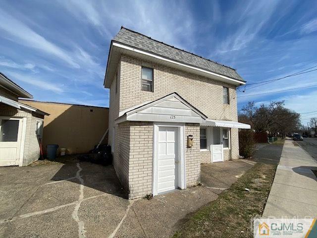 123 Kossuth Street Somerset, NJ 08873 - Photo 15 of 15 a front view of a house with garden